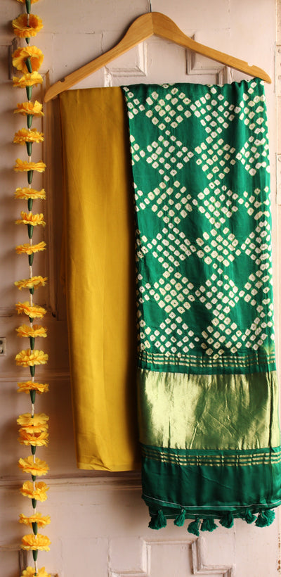 PARTHAVI : HANDMADE BANDHANI TISSUE DUPATTA WITH SOLID DYED MODAL SILK SUIT SET
