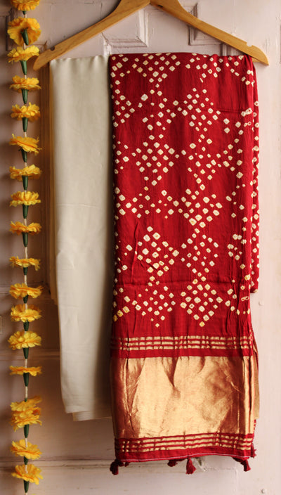 JOYA : HANDMADE BANDHANI TISSUE DUPATTA WITH SOLID DYED MODAL SILK SUIT SET