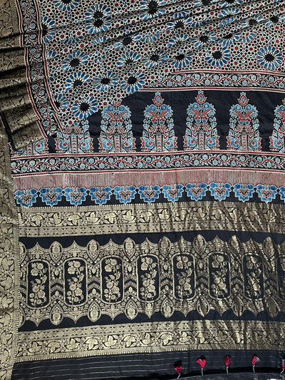 Dreamy Black:Handblock Ajrakh Dola Silk Saree With Meenakari Pallu.