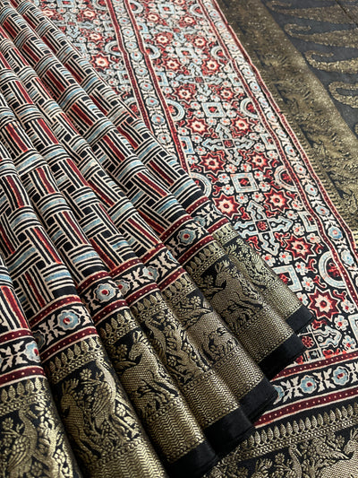 PRACHI:Handblock Ajrakh Dola Silk Saree with Meenakari Pallu