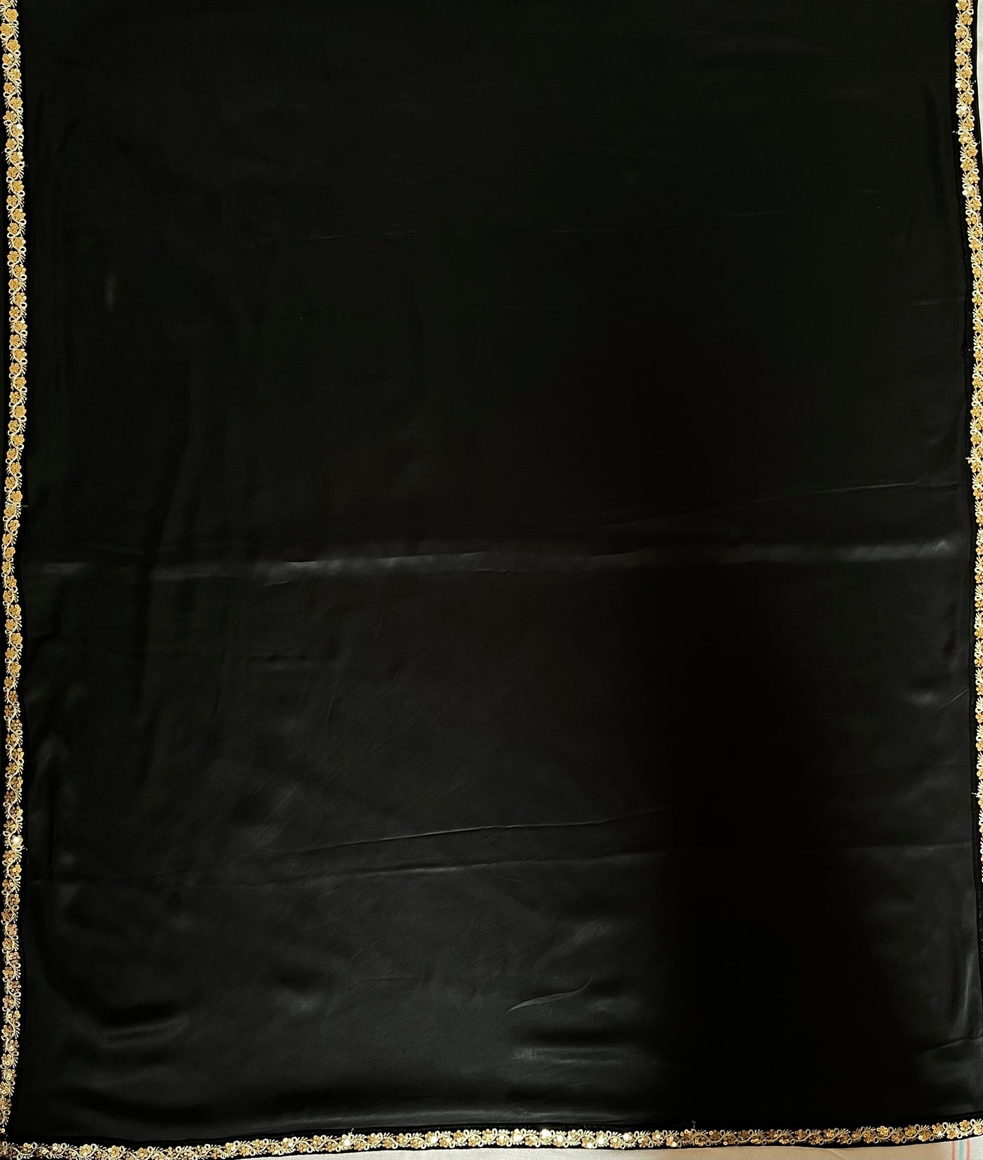 CHANDANI: Solid black modal silk with lace border saree