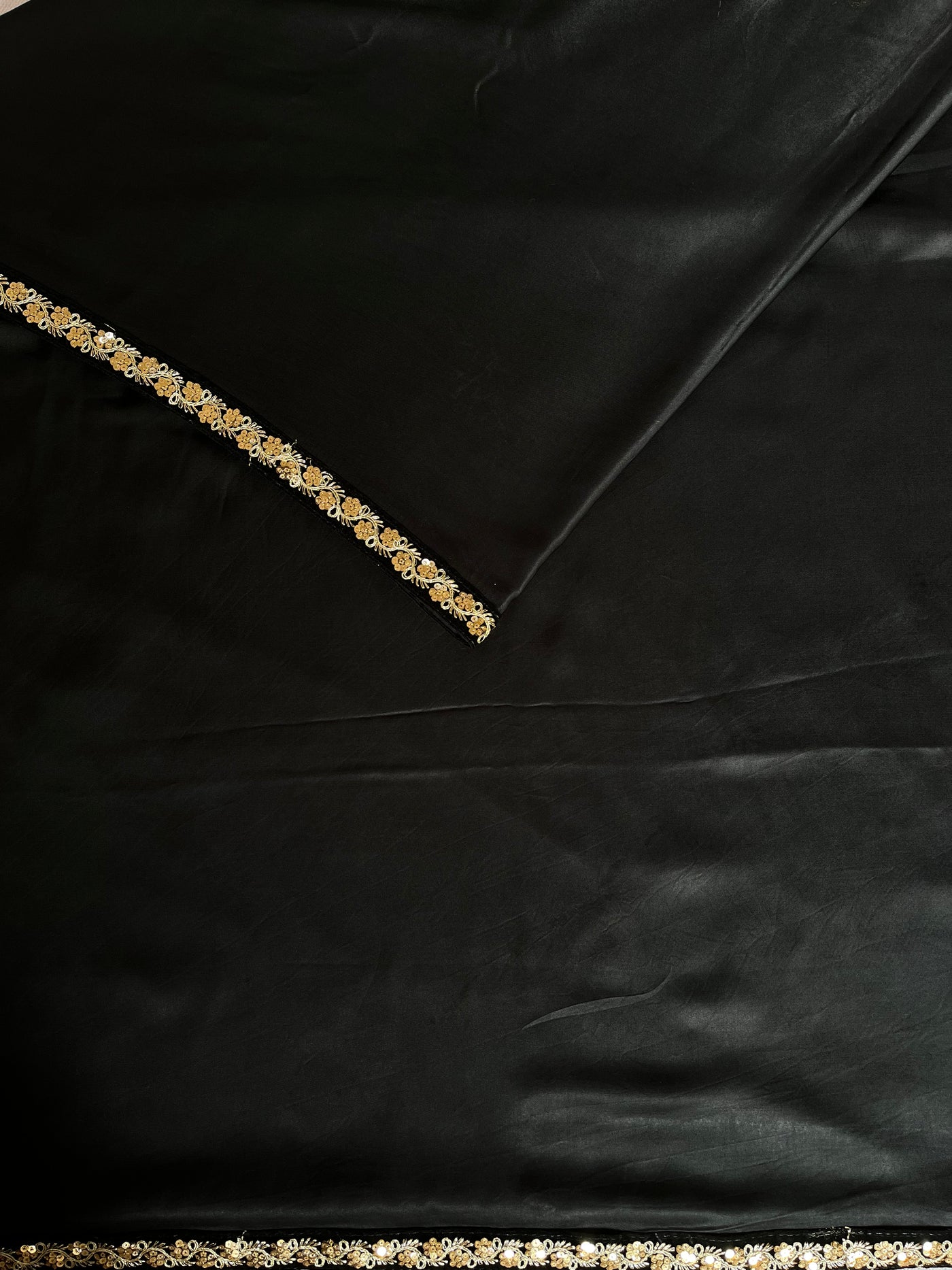 CHANDANI: Solid black modal silk with lace border saree