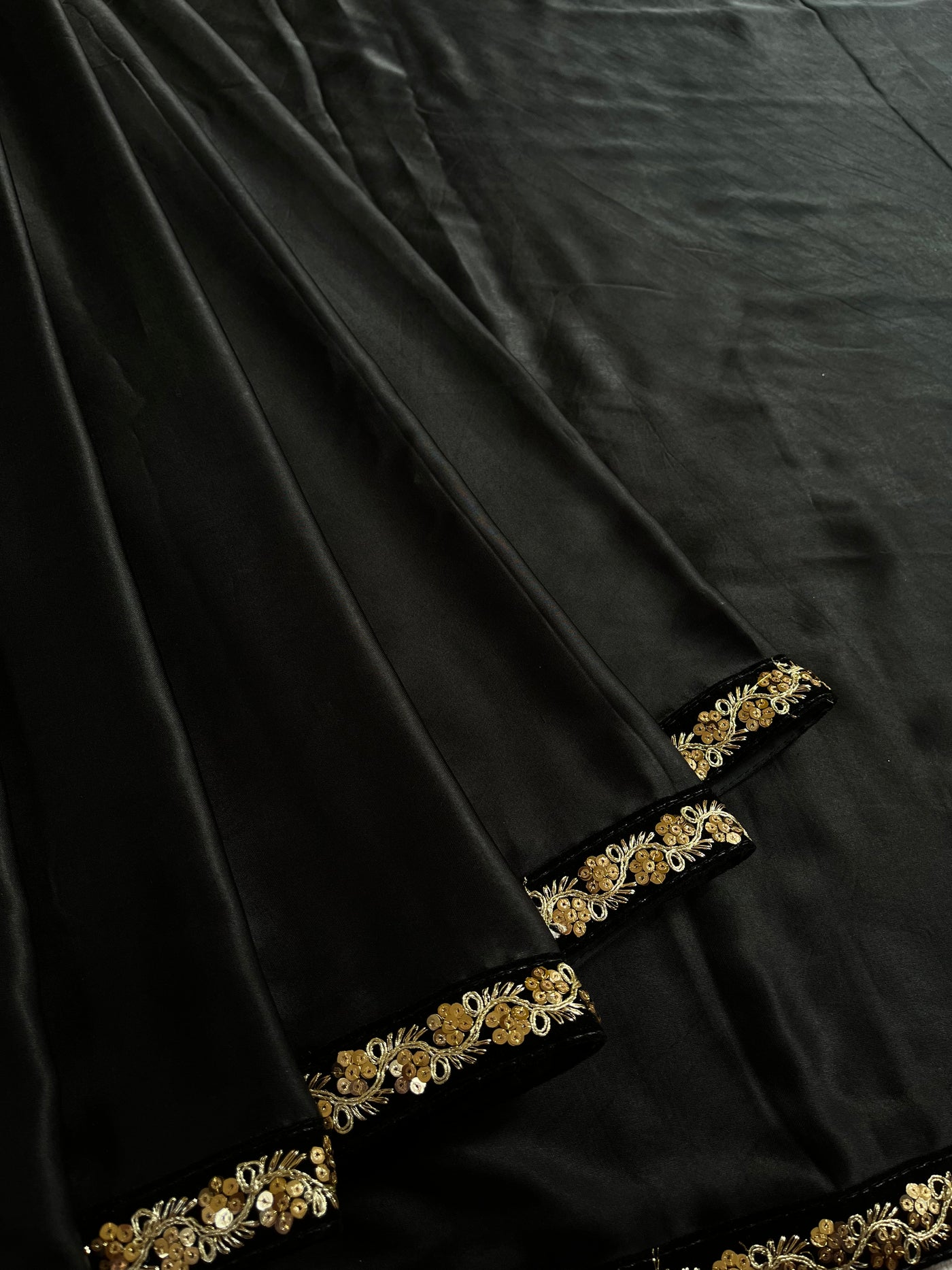 CHANDANI: Solid black modal silk with lace border saree