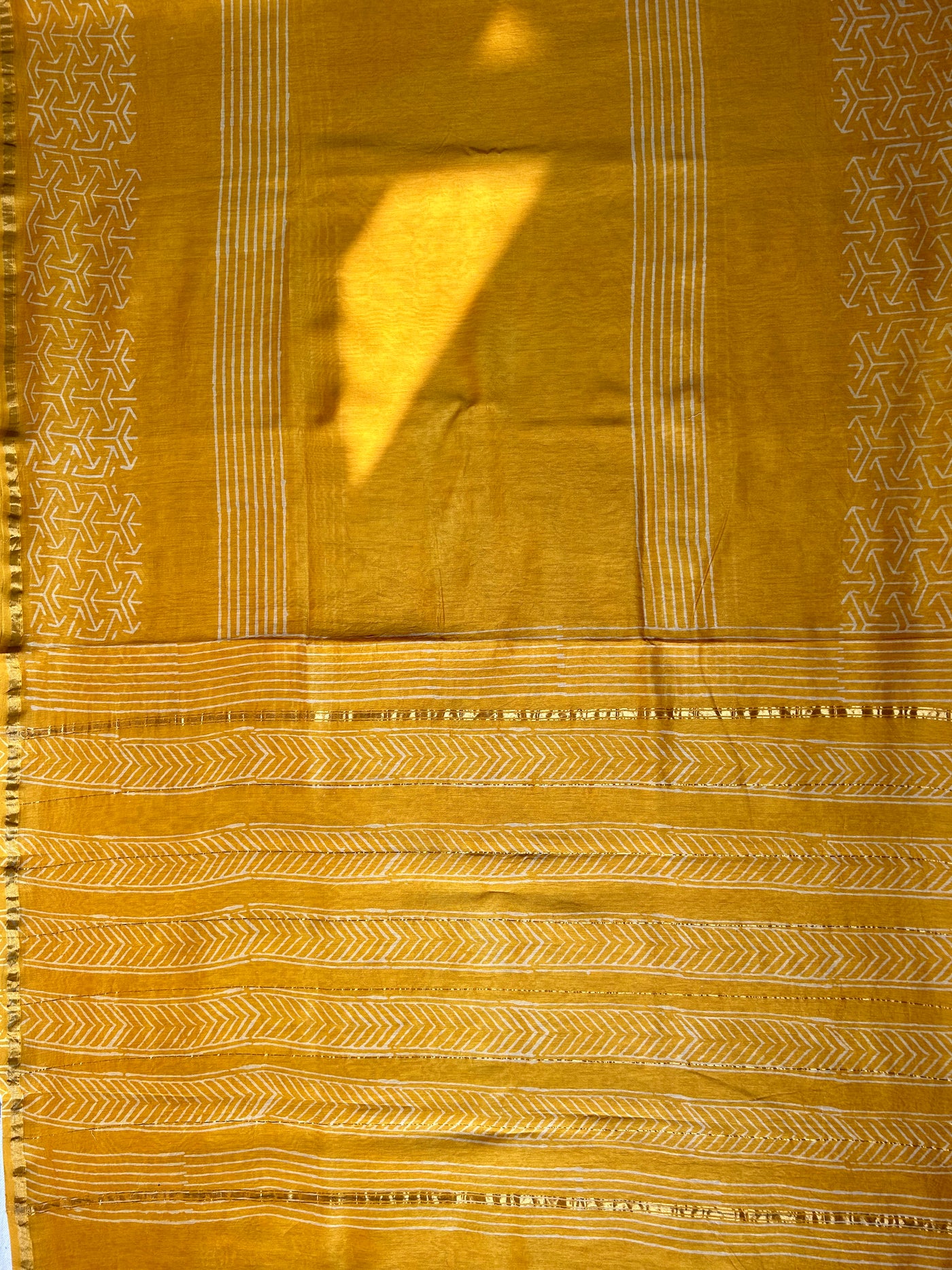 SUKNA: HANDBLOCK BAGRU PRINT CHANDERI SILK-COTT SAREE WITH ZARI BORDER.