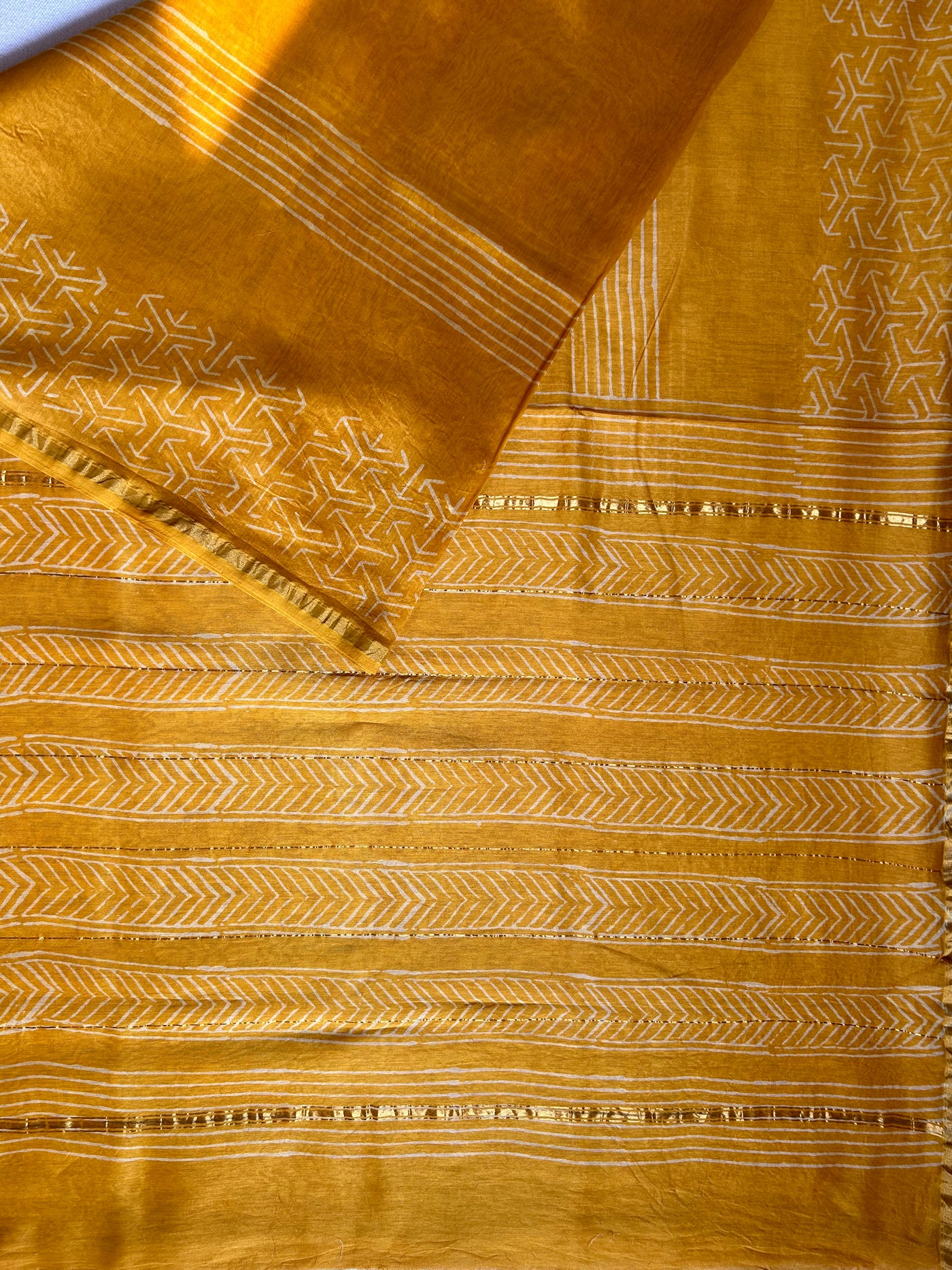 SUKNA: HANDBLOCK BAGRU PRINT CHANDERI SILK-COTT SAREE WITH ZARI BORDER.