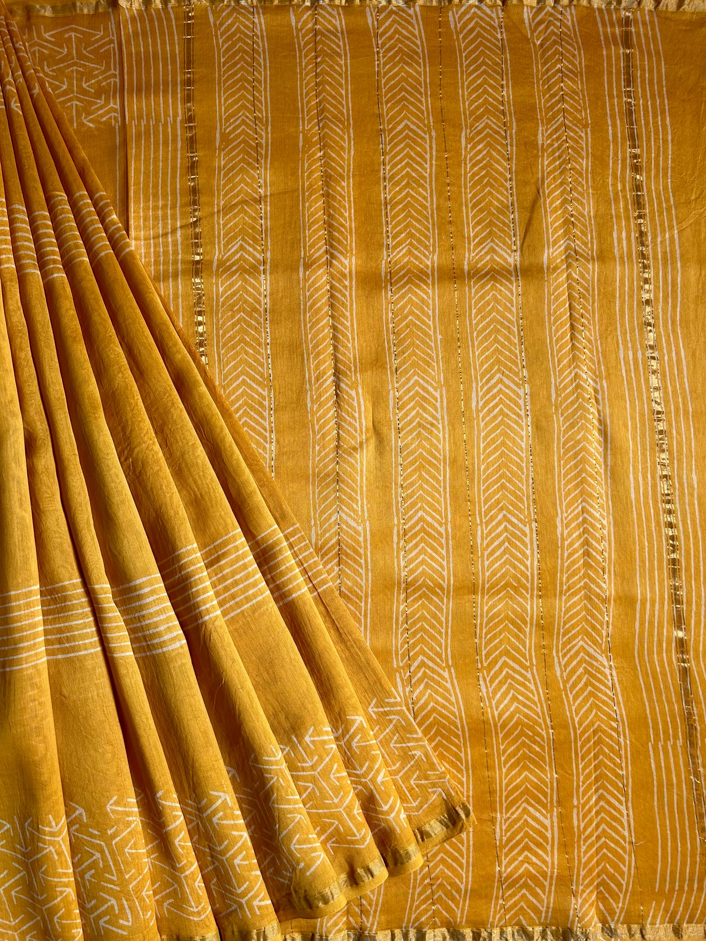 SUKNA: HANDBLOCK BAGRU PRINT CHANDERI SILK-COTT SAREE WITH ZARI BORDER.