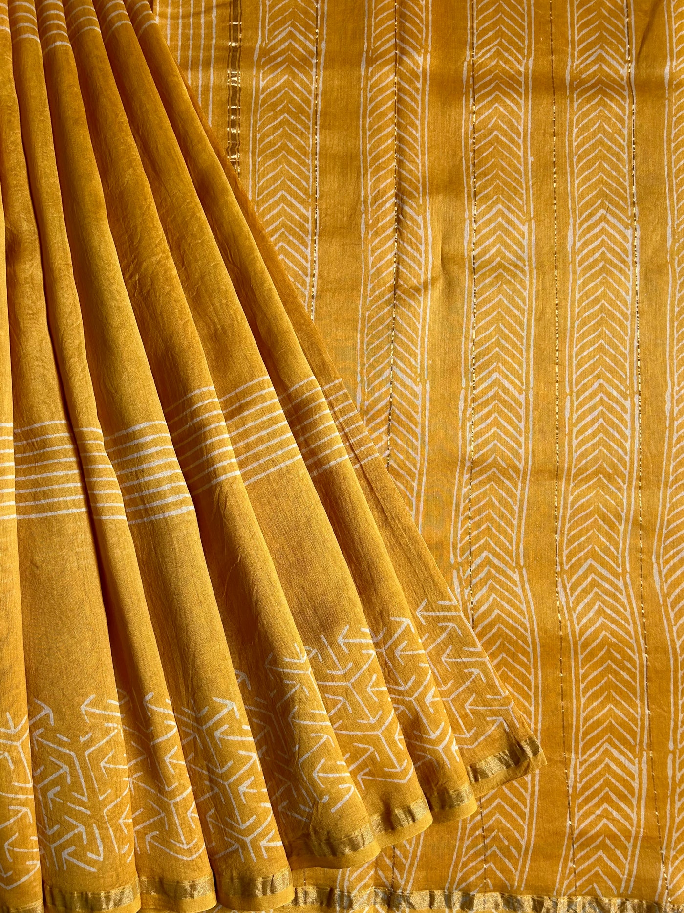 SUKNA: HANDBLOCK BAGRU PRINT CHANDERI SILK-COTT SAREE WITH ZARI BORDER.