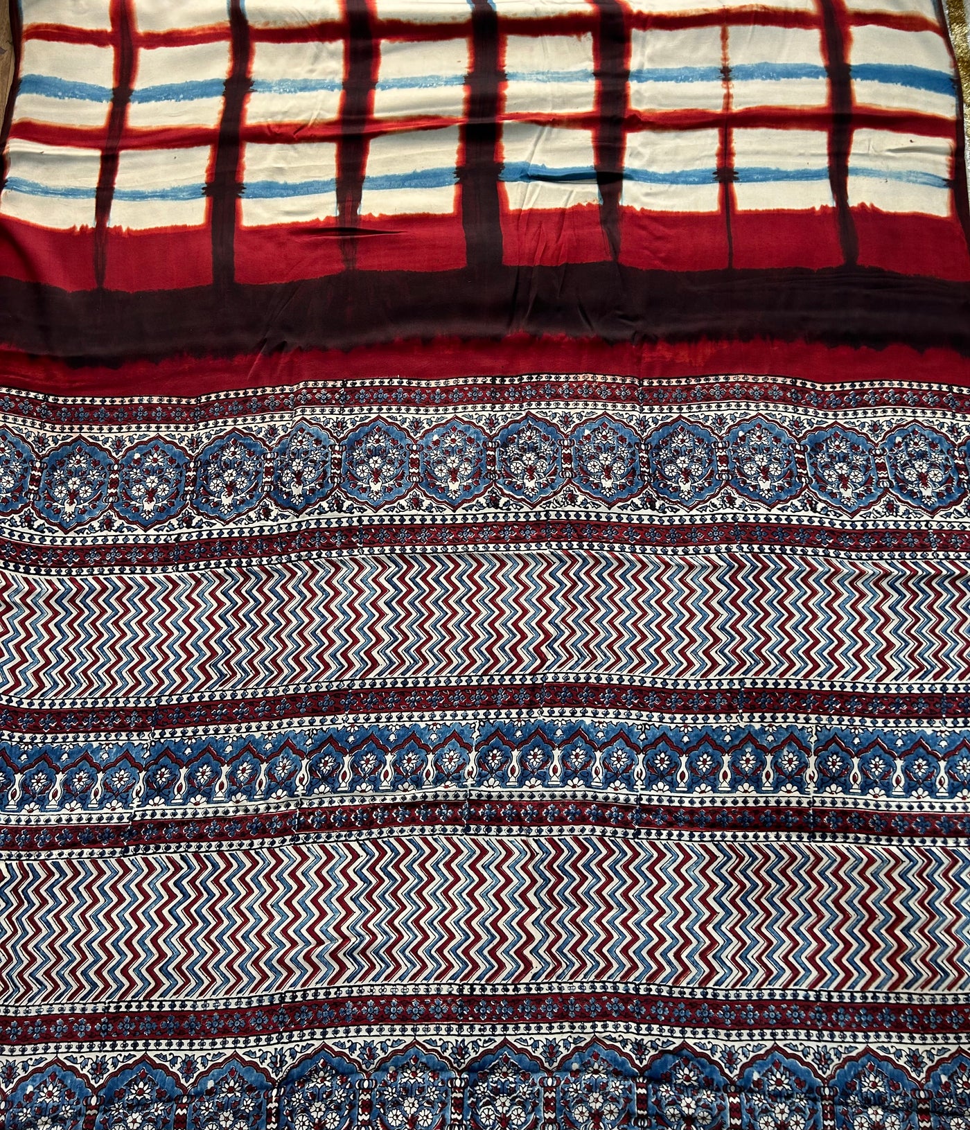 MYRA: Handmade Clamp Dyed- Ajrakh Modal Silk Saree