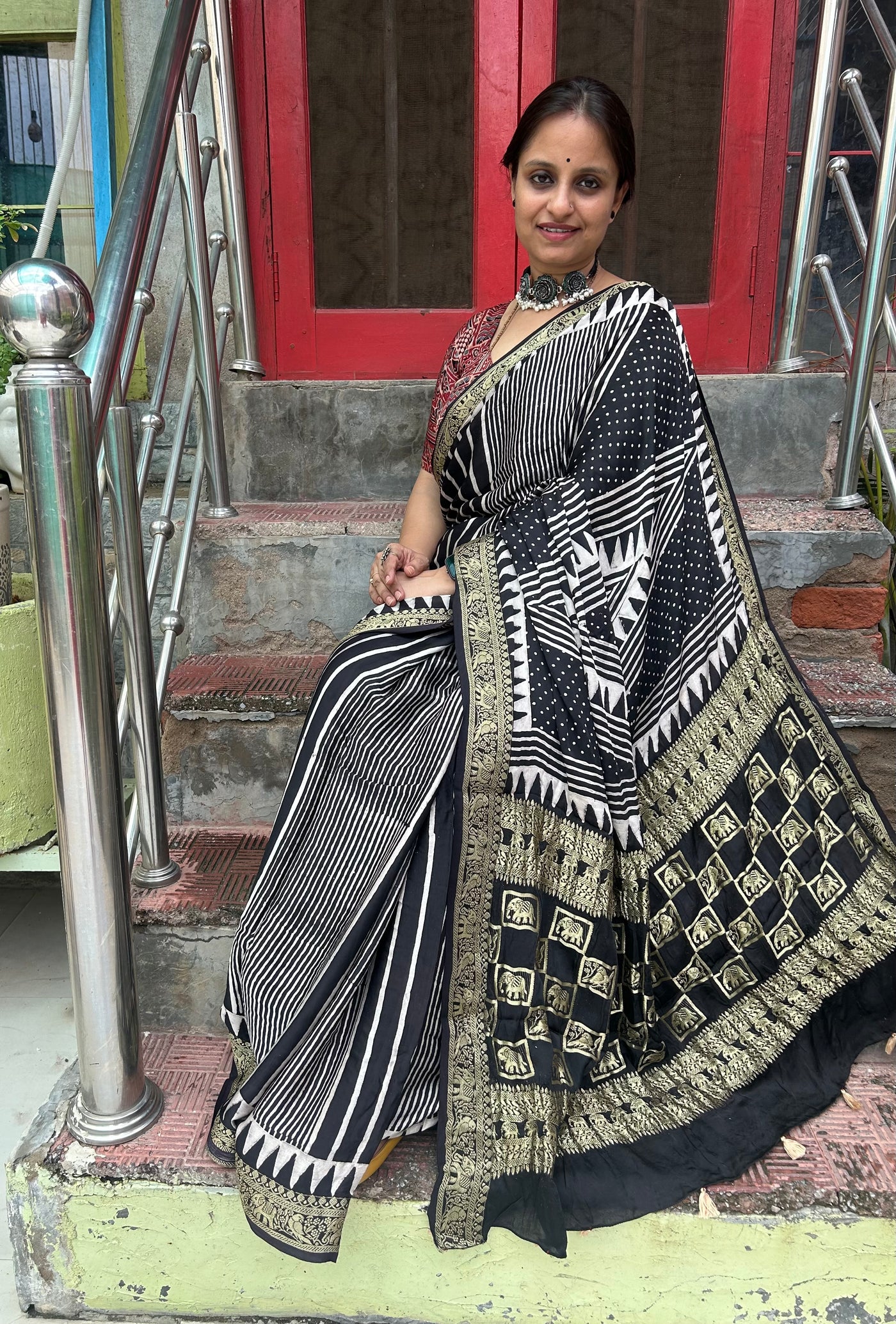 BADHAAI : Handblock Printed Ajrakh Modal Silk Meenakari Pallu Saree