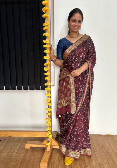 GEHNA: Handblock Printed Ajrakh Modal Silk Meenakari Pallu Saree