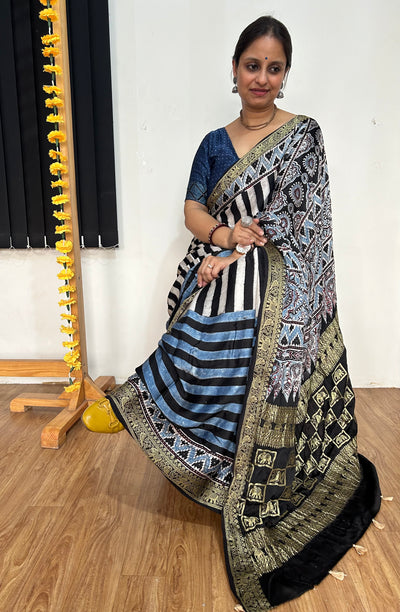 SHEHNAI: Handblock Printed Ajrakh Modal Silk Meenakari Pallu Saree