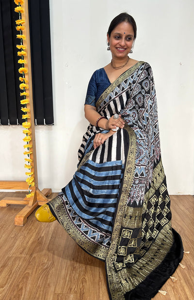 SHEHNAI: Handblock Printed Ajrakh Modal Silk Meenakari Pallu Saree