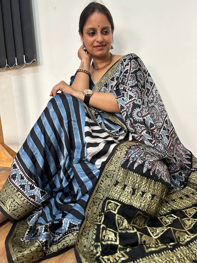 SHEHNAI: Handblock Printed Ajrakh Modal Silk Meenakari Pallu Saree