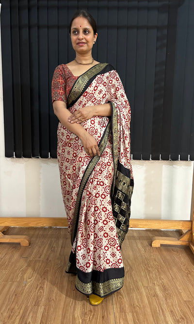 NAKSHATRA: Handblock Printed Ajrakh Modal silk Meenakari Pallu Saree