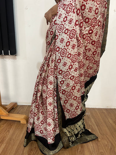 NAKSHATRA: Handblock Printed Ajrakh Modal silk Meenakari Pallu Saree