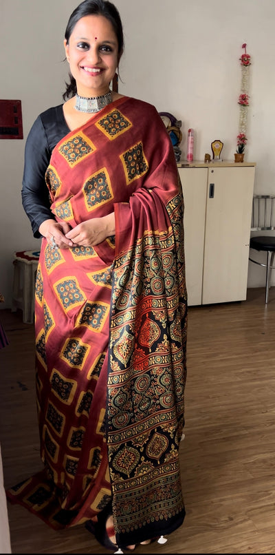 INAYA: Handmade Clamp Dyed- Ajrakh Modal Silk Saree