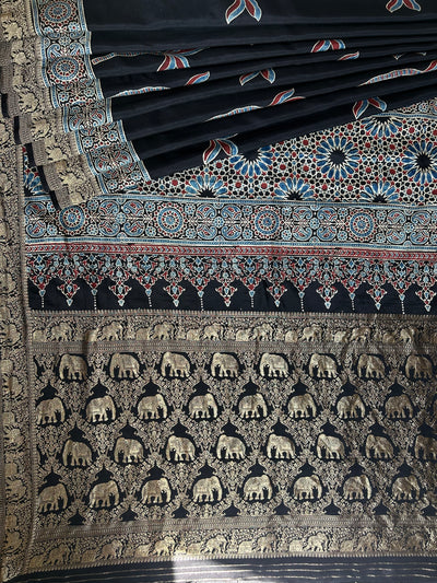 Laxmi:BLACK,HANDBLOCK AJRAKH DOLA SILK SAREE WITH MEENAKARI PALLU.