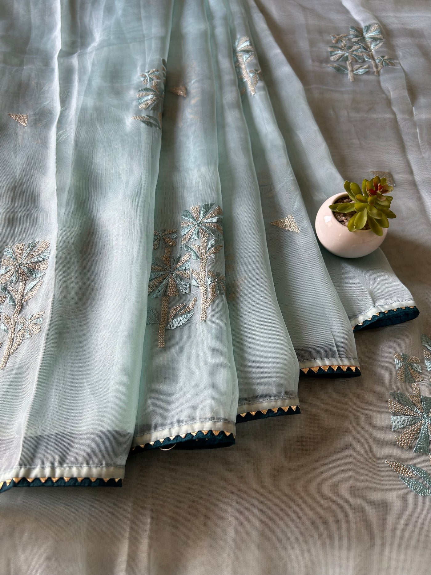 KANGNA: PASTEL BLUE, TISSUE ORGANZA PARTY WEAR SAREE WITH ALL OVER EMBROIDERY.