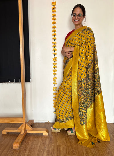 Aarzu: HANDBLOCK AJRAKH DOLA SILK SAREE WITH MEENAKARI PALLU.