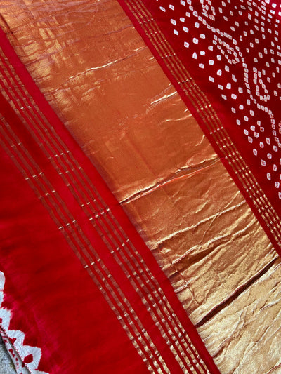 SAKHI: RED,HANDMADE BANDHANI MODAL SILK SAREE WITH TISSUE PALLU.