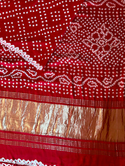 SAKHI: RED,HANDMADE BANDHANI MODAL SILK SAREE WITH TISSUE PALLU.