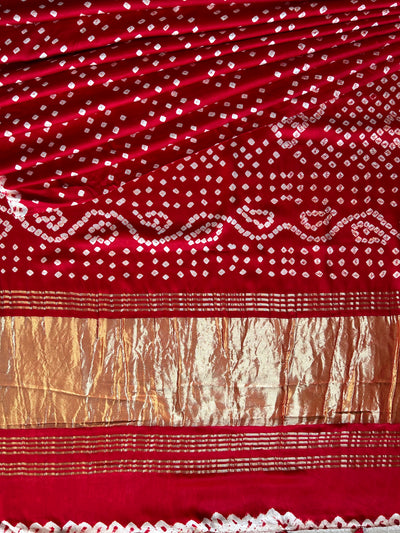 SAKHI: RED,HANDMADE BANDHANI MODAL SILK SAREE WITH TISSUE PALLU.