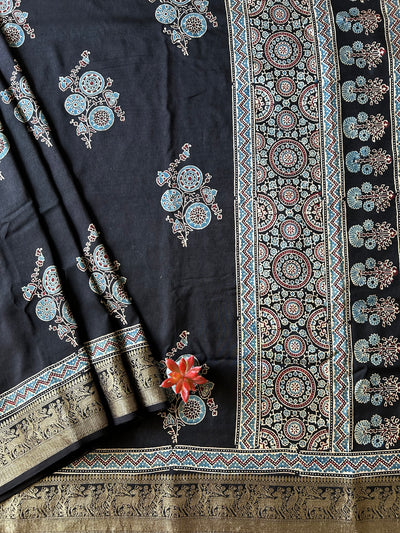 KESHAV:BLACK,HANDBLOCK AJRAKH DOLA SILK SAREE WITH MEENAKARI PALLU.