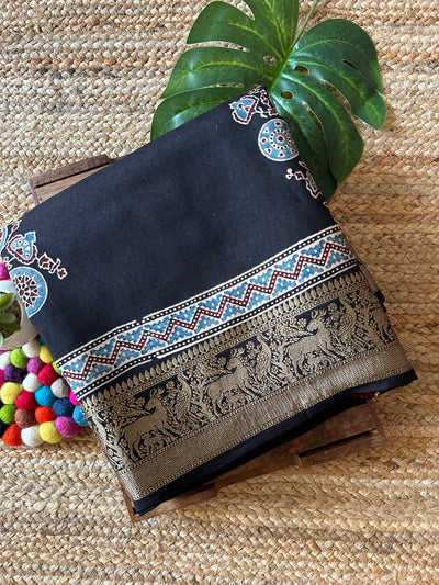 KESHAV:BLACK,HANDBLOCK AJRAKH DOLA SILK SAREE WITH MEENAKARI PALLU.