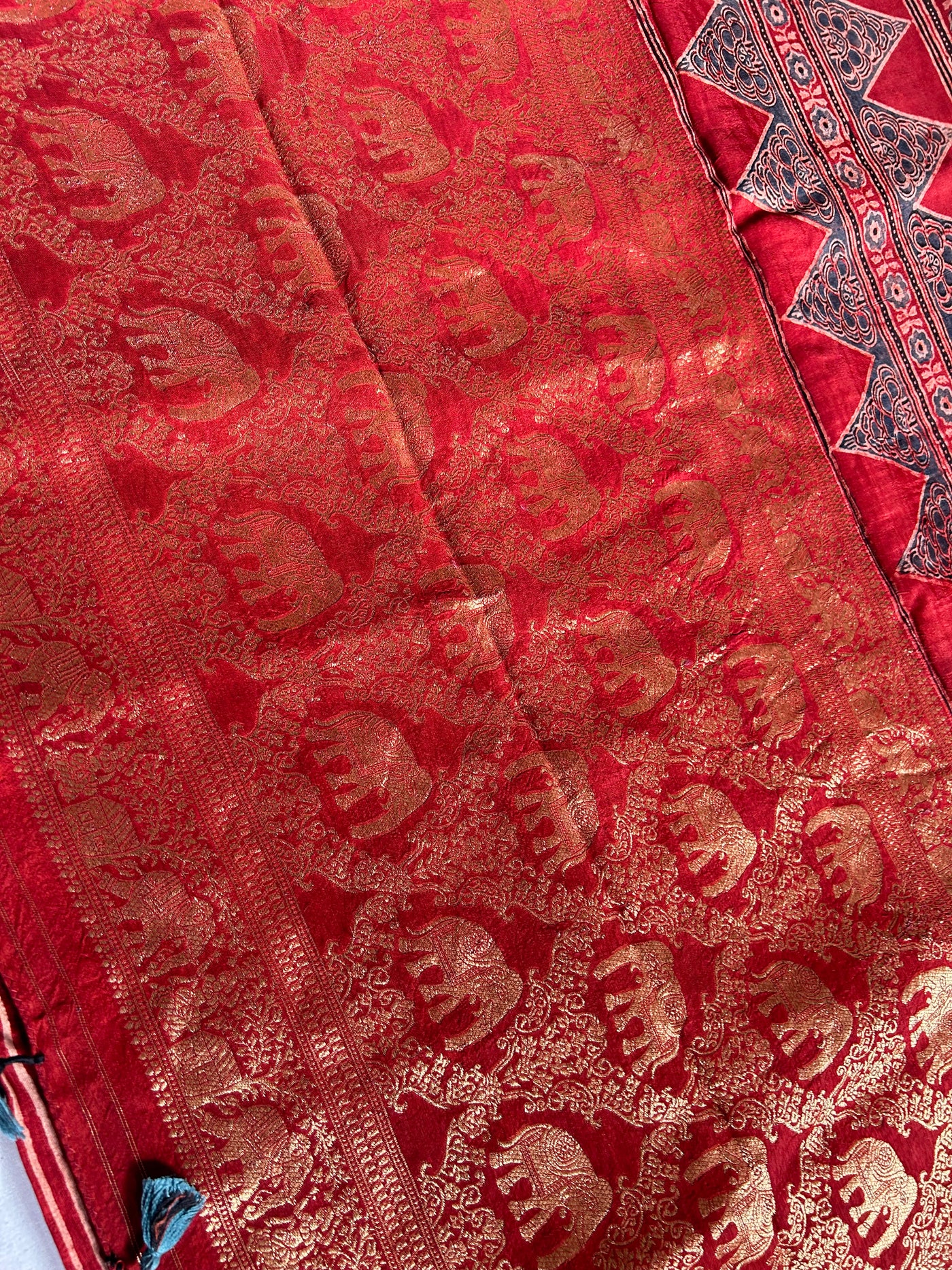 PRISHA:MADDER,HANDBLOCK AJRAKH DOLA SILK SAREE WITH MEENAKARI PALLU.