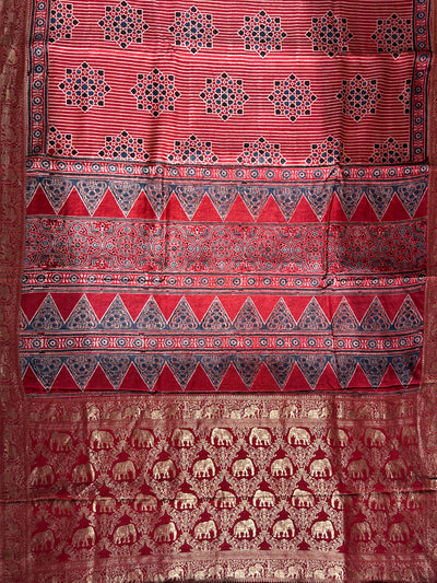 PRISHA:MADDER,HANDBLOCK AJRAKH DOLA SILK SAREE WITH MEENAKARI PALLU.