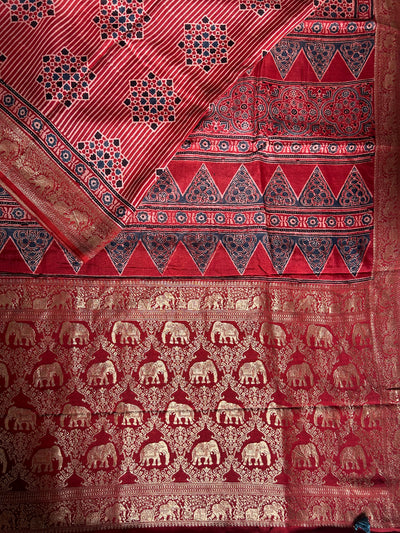 PRISHA:MADDER,HANDBLOCK AJRAKH DOLA SILK SAREE WITH MEENAKARI PALLU.