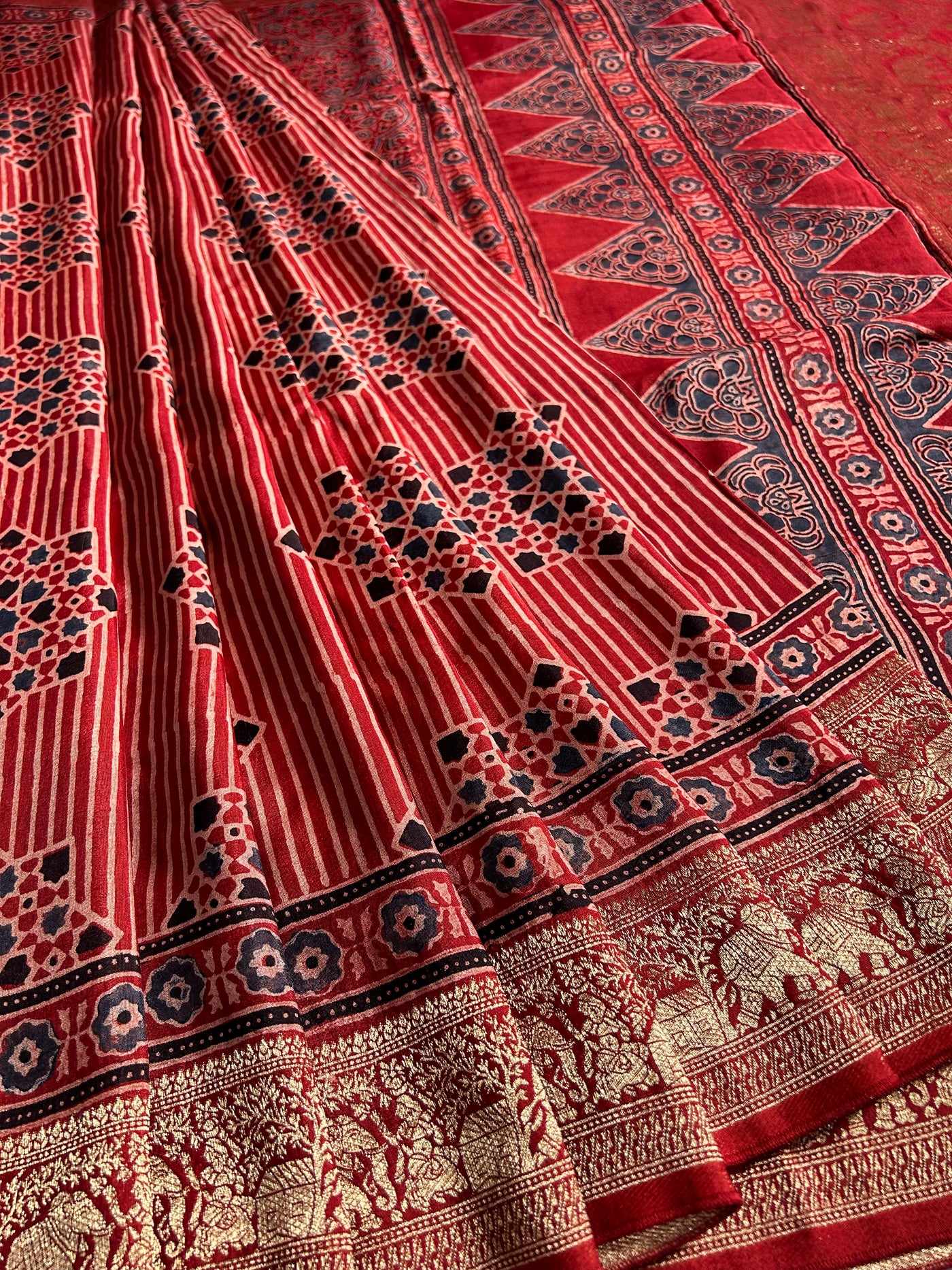 PRISHA:MADDER,HANDBLOCK AJRAKH DOLA SILK SAREE WITH MEENAKARI PALLU.