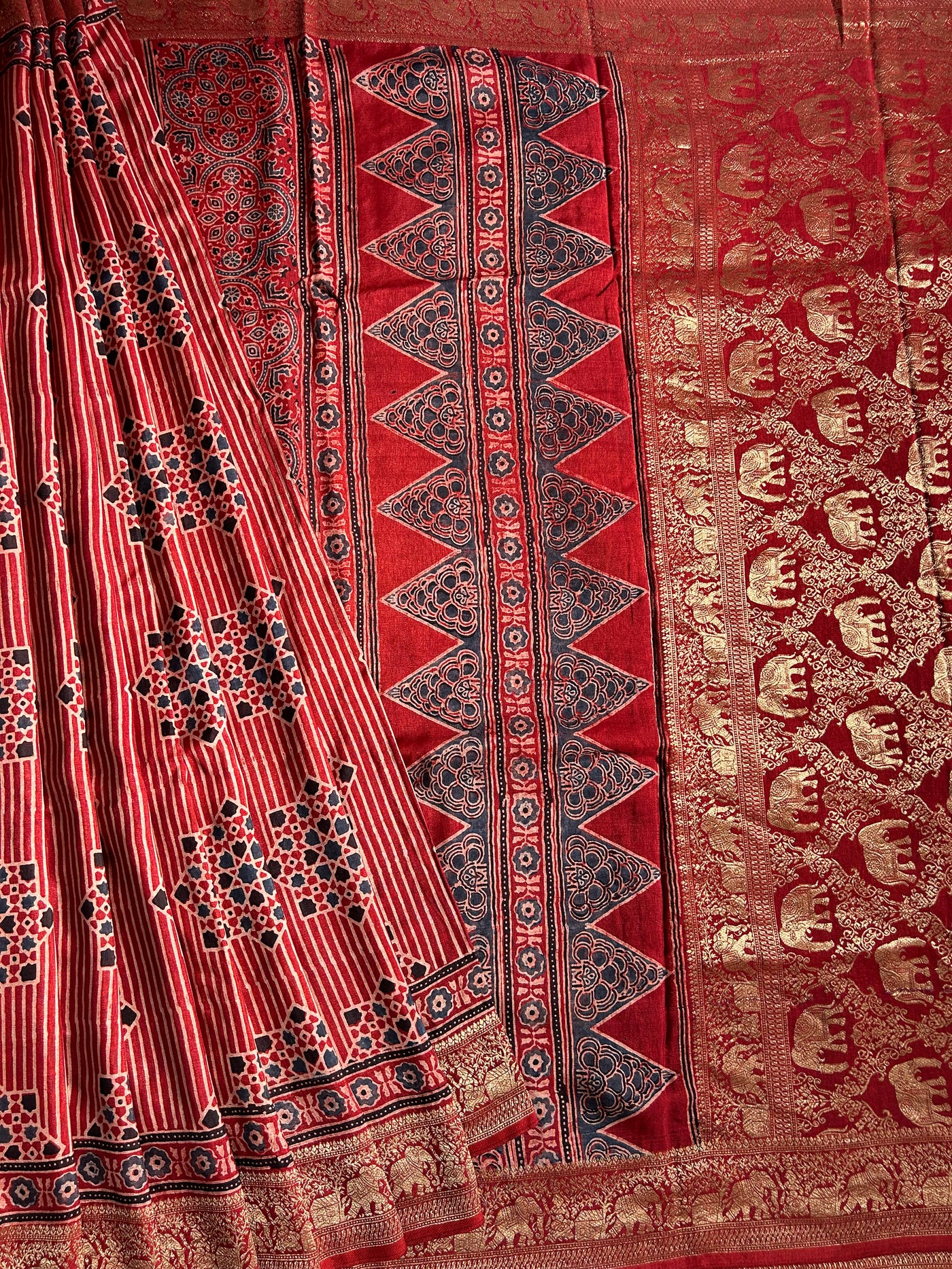 PRISHA:MADDER,HANDBLOCK AJRAKH DOLA SILK SAREE WITH MEENAKARI PALLU.